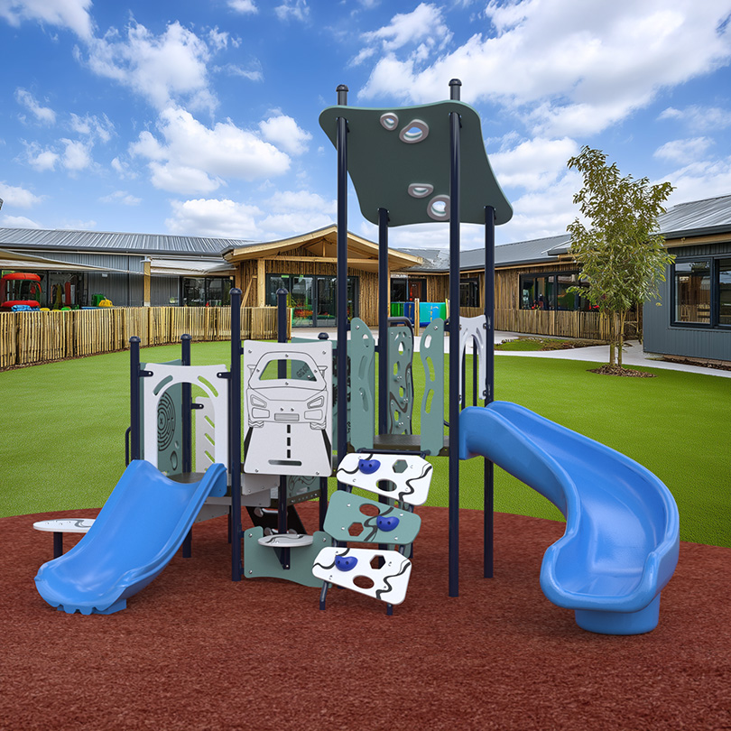 Toddler playground with slides and interactive panels in a childcare outdoor play area